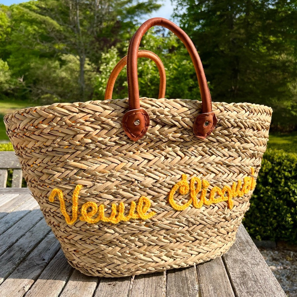 Veuve Clicquot straw bag with hat, glasses and carrying case.